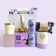 Luxurious Pamper Queen gift box featuring relaxing bath salts, aromatic candle, soothing eye pillow, and gourmet treats.