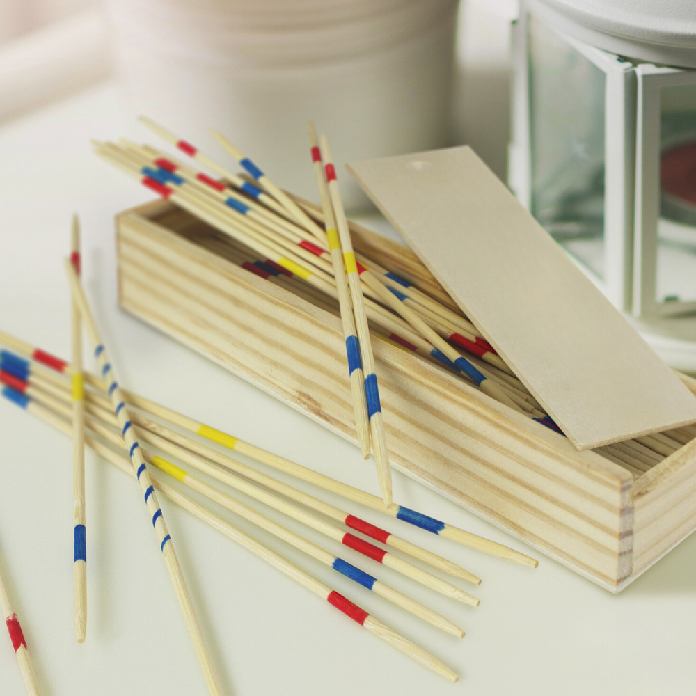 Classic Pick Up Sticks Game in a wooden box, featuring vibrant sticks for skillful fun at gatherings and family game nights.