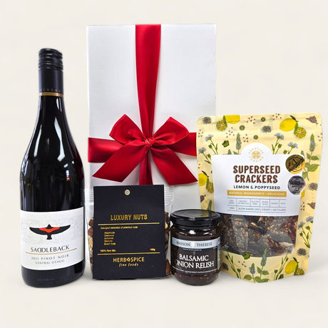 Elegant gift box featuring Peregrine Pinot Noir and gourmet nibbles, ideal for wine enthusiasts and special occasions.