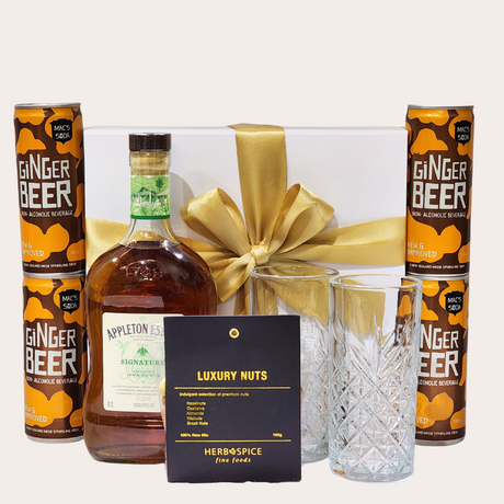 Elegant gift box featuring Appleton Estate rum, gourmet snacks, and ginger beer, perfect for any celebration.