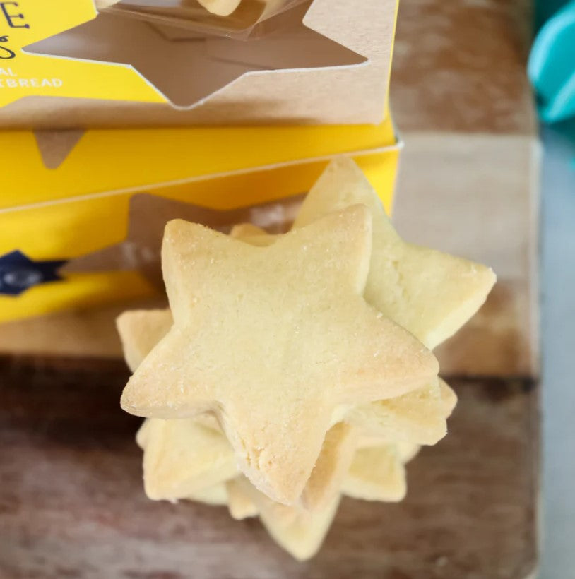 Star-shaped festive shortbread cookies with a buttery texture, perfect for sharing and gifting during the holidays.